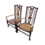 A pair of stained arts & crafts style nursing or bedroom chairs, the backs with arched rails above