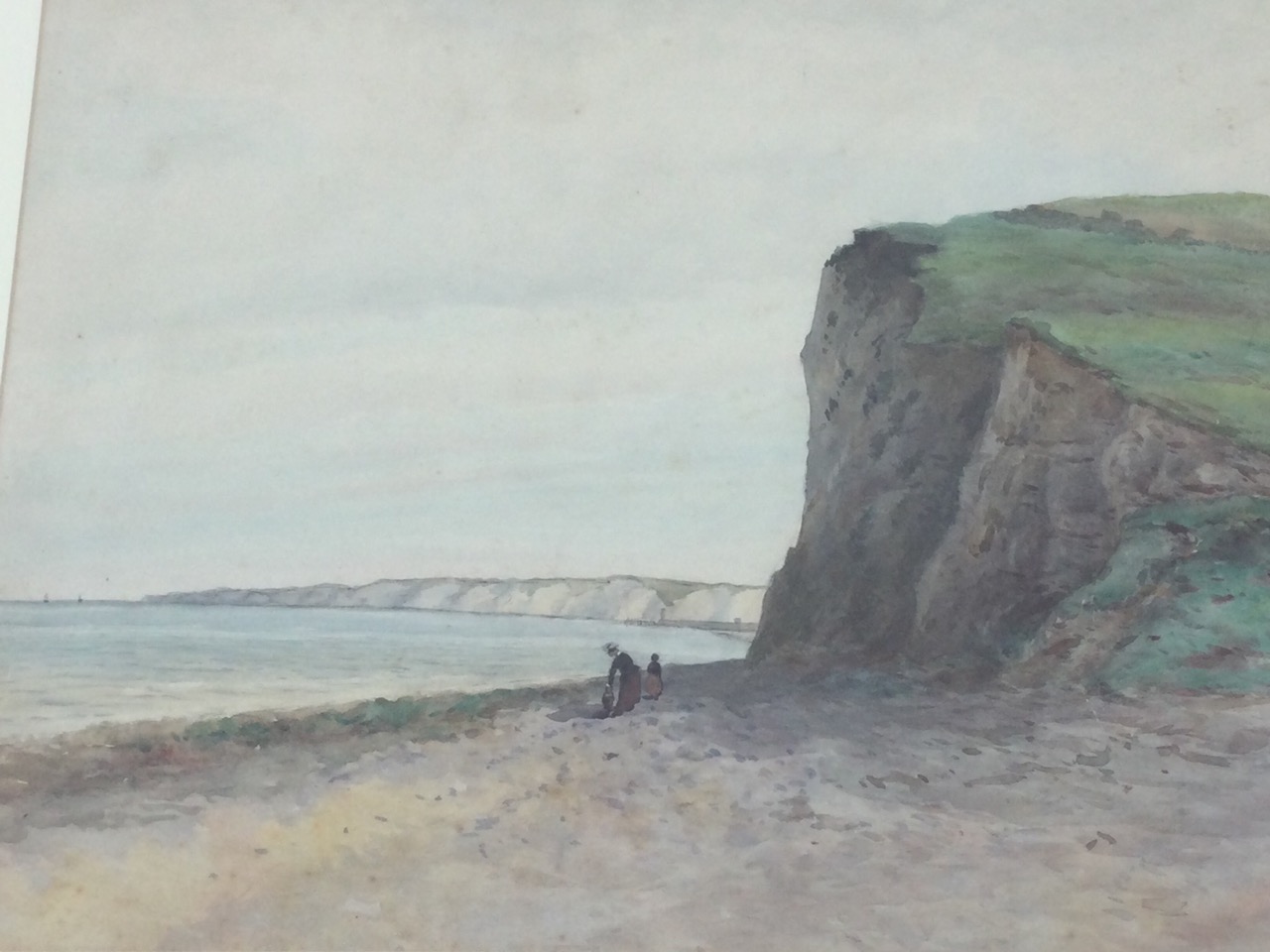 Late nineteenth century English school, watercolour, coastal view with figures on beach, possibly