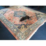 A large chenille style carpet woven with central blue floral medallion and conforming spandrels on