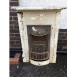 A late Victorian cast iron chimneypiece with rounded moulded mantleshelf above a deep plain