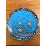 A C20th cloisonné dish enamelled with duck and flowers on blue ground framed by geometric scrolled