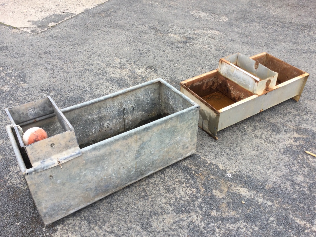 A rectangular galvanised water trough with tubular rim having enclosure to end for ball valve - 39.
