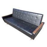 A 1970s Lebus button upholstered sofabed, with rectangular cushioned panels and padded arms