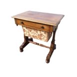 A Victorian mahogany sewing table, the rectangular moulded top above a frieze drawer and work