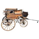 A nineteenth century four-wheel dog cart for a single or a pair, the cart with iron mounts on twin