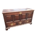 An eighteenth century dowel jointed oak coffer, the rectangular hinged top revealing an interior