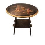 An oval Japanese lacquered occasional table, the top with single figure & dog in garden framed by