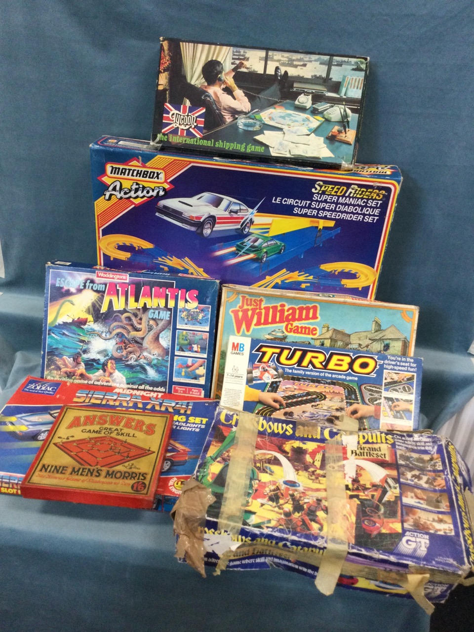 A boxed Matchbox Speed Riders set (no cars), and other large boxed games - Crossbows & Catapults,