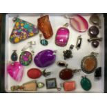 Twenty-two semi-precious stone pendants, mostly mounted in silver, with various shapes and different