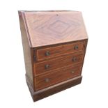 An Edwardian mahogany bureau crossbanded in satinwood and inlaid with boxwood stringing, the