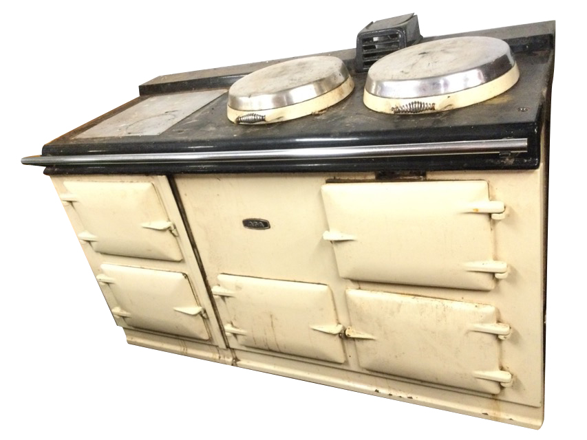 A four oven oil fired Aga, the cream enamelled stove with warming plate and two circular hinged