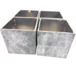 A set of four square faux lead garden tubs. (17.5in x 17.5in x 18in) (4)