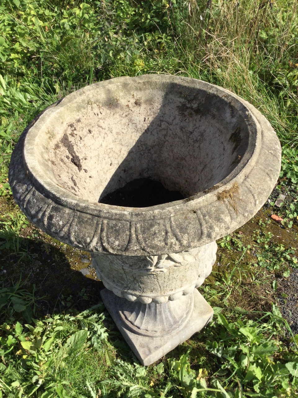 A large composition stone campana style urn, with moulded overhanging egg & dart rim above a waisted - Image 3 of 3