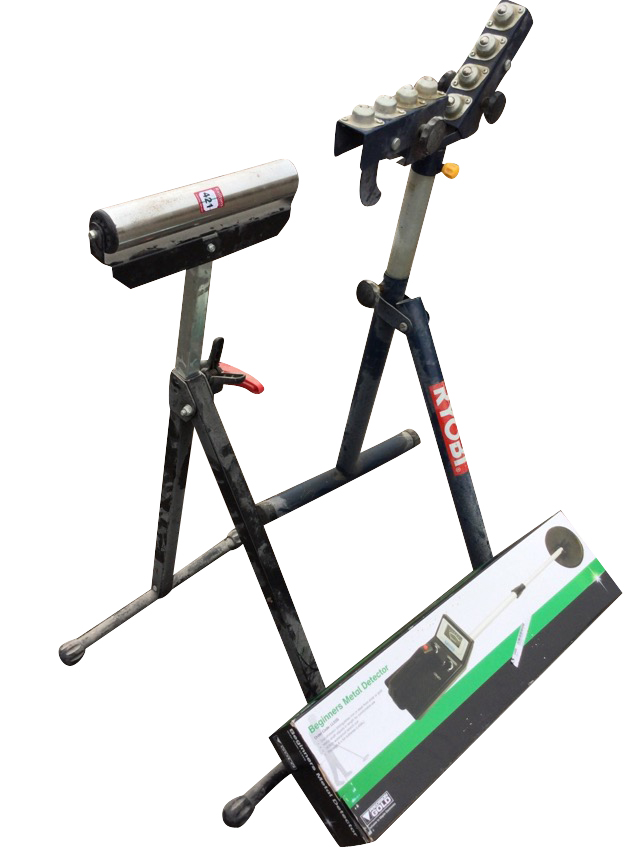 A Ryobi workshop stand for supporting wood; another similar with roller; and a boxed metal detector.