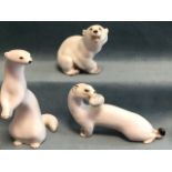 Three Russian porcelain blanc-de-chine animals - a polar bear, a stoat and a weasel, printed red
