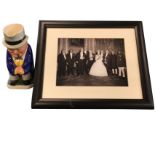 A framed photograph of the Queen with Winston Churchill and a group of Commonwealth