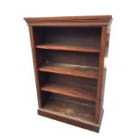 A mahogany open bookcase with rectangular moulded top above four shelves, raised on moulded