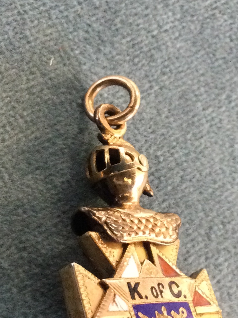 An enamelled gold fob of maltese cross form, one side with applied skull & crossbones with the - Image 3 of 3