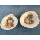 A pair of handmade Beatrix Potter characters made from shells, mounted within shells The Tailor of