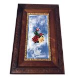 A Victorian oak framed mirror with outer press-carved border of foliate scrolled decoration around a