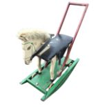 A childs painted rocking horse on wood wheels, with upholstered seat and leather reins & straps