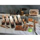 A box of tools including four Stanley planes, leather cased punches & cutters, other planes, a