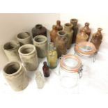 A collection of stoneware jars & glass dump bottles; and a pair of Kilner jars & covers. (20)
