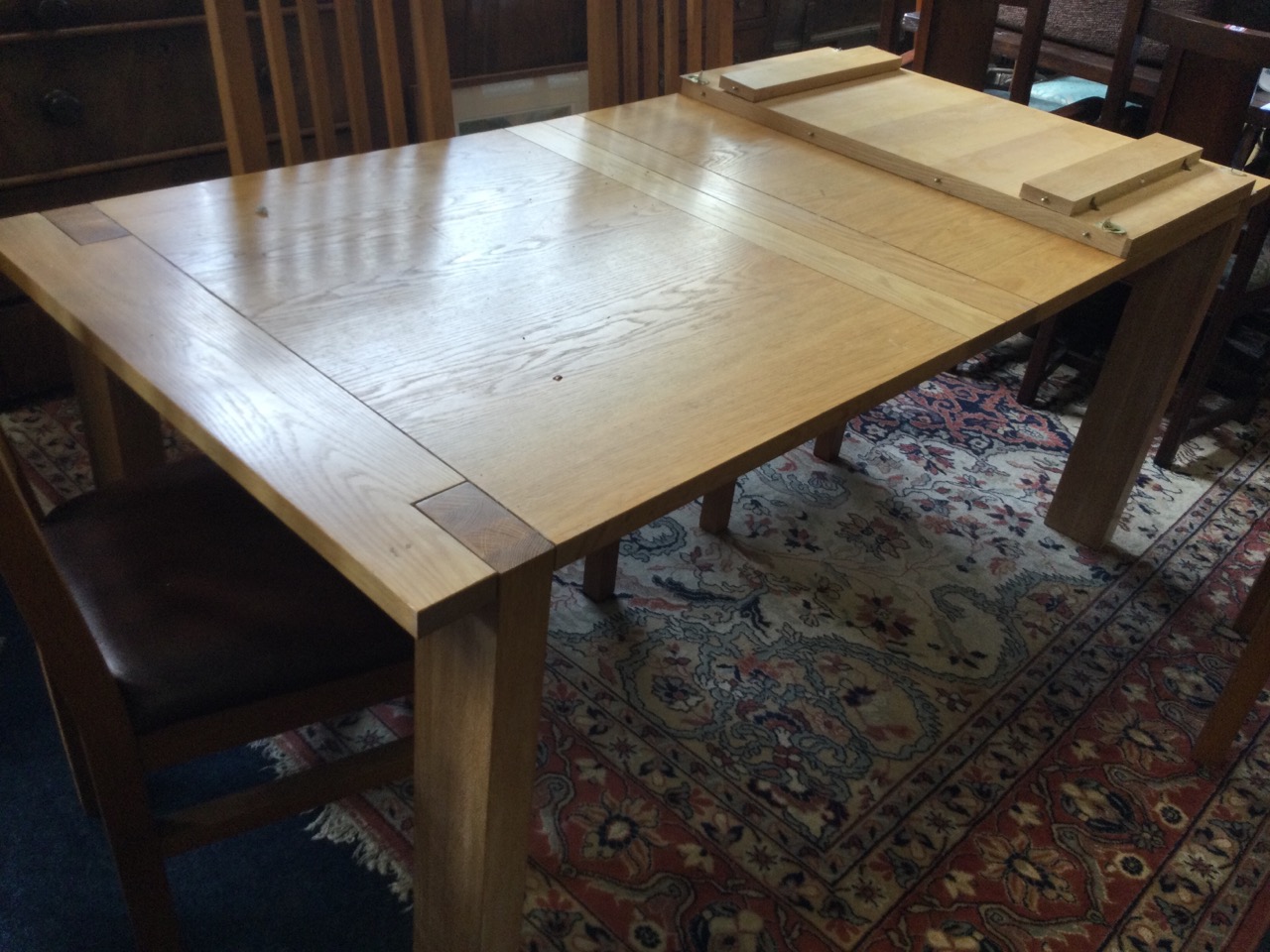 A rectangular limed oak draw-leaf kitchen table, the cleated top on rectangular legs, with spare - Image 2 of 3