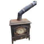 An Efel cast iron wood burning stove with rectangular moulded top and arched glazed door with