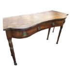 A nineteenth century serpentine shaped mahogany side table, the top with ribbed edge above three