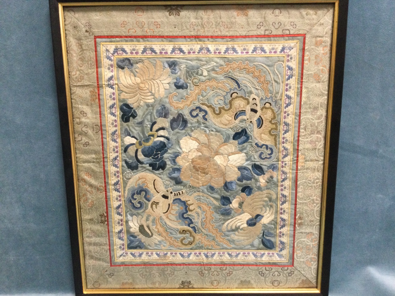 A Chinese floral embroidered panel in fine silks depicting butterflies and blossom foliage on pale - Image 2 of 3