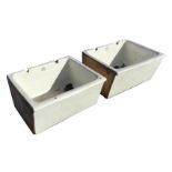 A pair of large butlers sinks by J & R Howie, the basins with angled fronts having cushion moulded