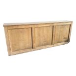 A rectangular oak bar with three panels to front and open back, complete with coolers and associated