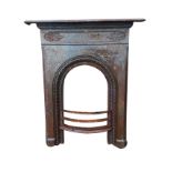 A Victorian cast iron fireplace with rectangular rounded moulded mantlepiece above a scroll cast