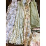 Four pairs of curtains, all having pencil pleat tops, two with floral patterns, three pairs