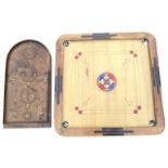 A square tabletop billiards type game with painted board to square rounded frame, having pockets