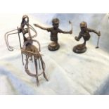 A pair of contemporary bronze stylised golfers, the celebratory figures mounted on oval moulded