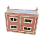 A C20th childs dolls house with pitched roof and two chimneys, the front elevation opening as two
