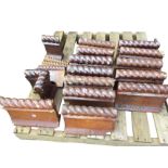 A collection of salt glazed stoneware edging bricks with twisted rails and flared bases - 13 @ 12in,