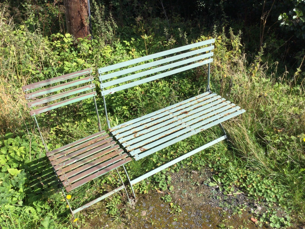 A folding painted metal garden bench & chair, the slatted backs and seats on iron cross-frames. (2) - Image 3 of 3