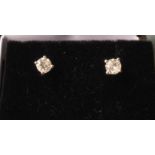A pair of 18ct gold diamond stud earrings, the claw set stones of under half a carat, with