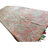 A C20th paisley shawl, woven on both sides within a rectangular borders, with tassels to ends. (65in