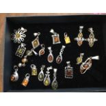 Twenty silver contemporary amber pendants, mounted for chains, various shapes - teardrop, oval,