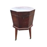 A Georgian mahogany lead lined octagonal wine cooler, the tapering cabinet on stand with moulded