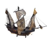 A painted wood model of a galleon Santa Maria, the three masted ship with cloth sails and cord