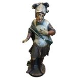 A nineteenth century painted and carved wood figure of a helmeted soldier, with flowering cloak,