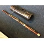 A leather cased rosewood & bakelite bassoon by Boosey & Co Ltd, the instrument with silver plated