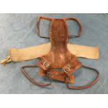 A rare 1950s experimental canvas, steel and leather protective spinal brace, as used by jet pilots