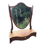 A nineteenth century mahogany dressing table mirror with shield shaped plate on tapering supports