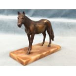 A bronzed cast of a horse, mounted on rectangular plinth. (9in x 4in x 7.5in)